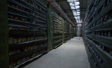 Modern cryptocurrency mining farm with thousands of miners running simultaneously